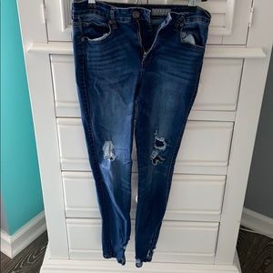 slightly ripped skinny blue jeans